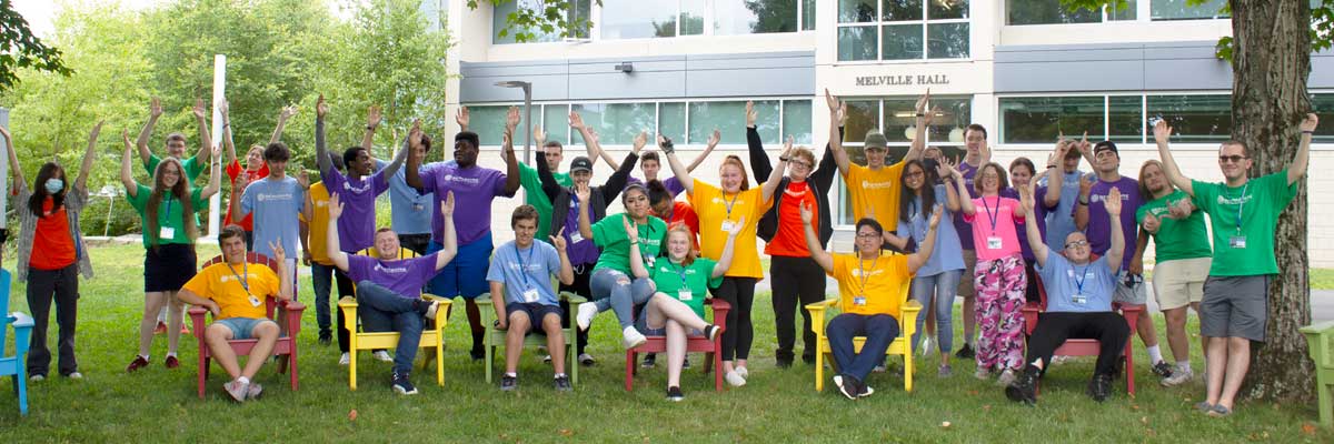 BCC students posing with raised arms