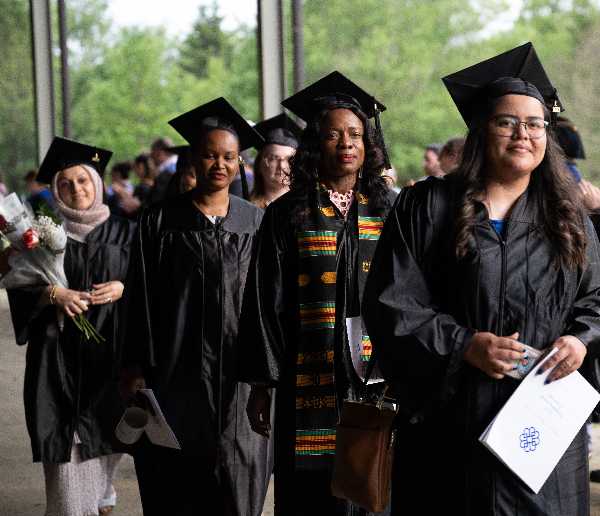 BCC graduates in caps and gowns at Tanglewood