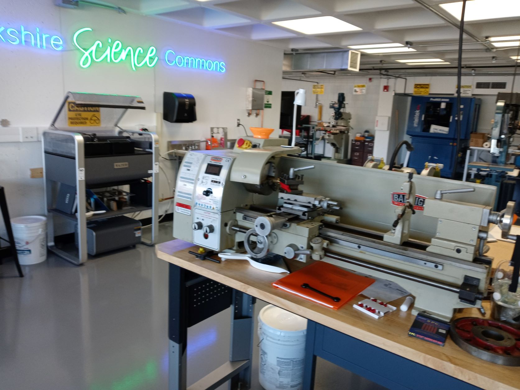 Berkshire Science Commons with neon sign and several machines