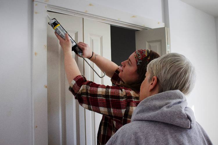 Service Learning students working on a home construction project