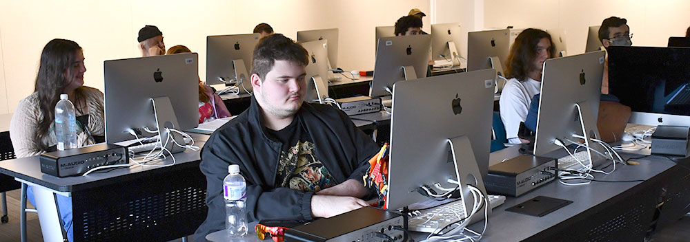 Students take a course in the Mac Lab in the Koussevitzky building at BCC.