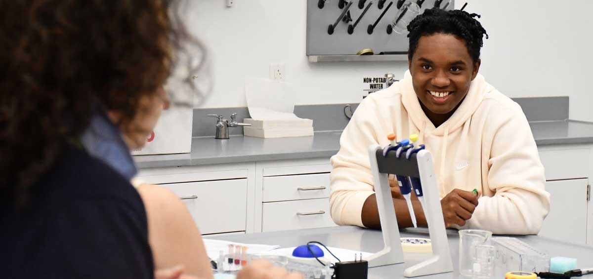 Students in a lab working with liquid samples