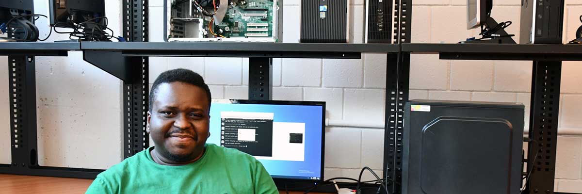 BCC Computer Science student working on a desktop computer