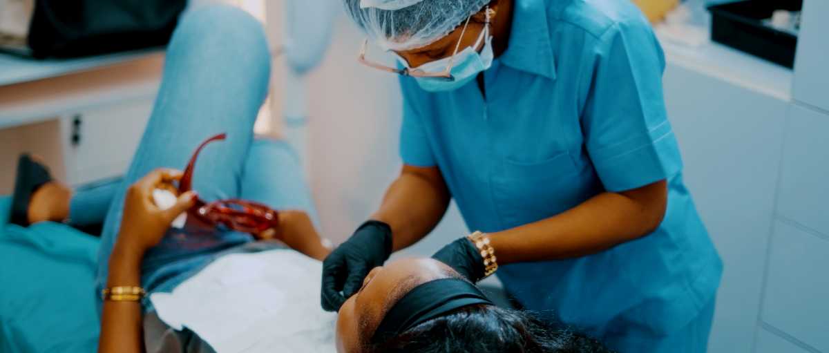 Dental assistant working with a client